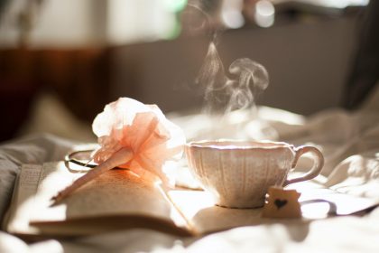 A steamy cup of tea on a book.