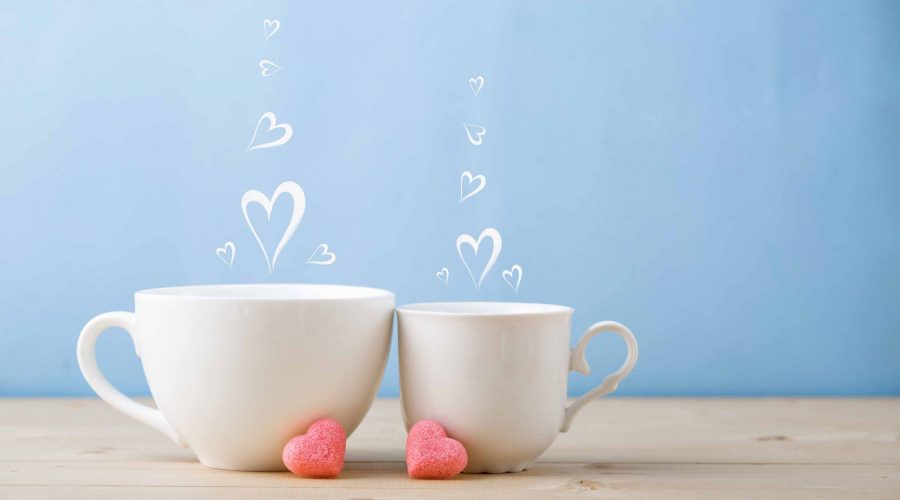 Two teacups with steam hearts
