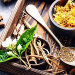 a wooden tray with herbs