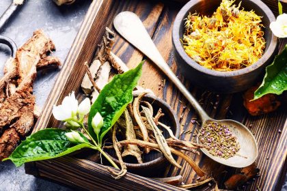 a wooden tray with herbs