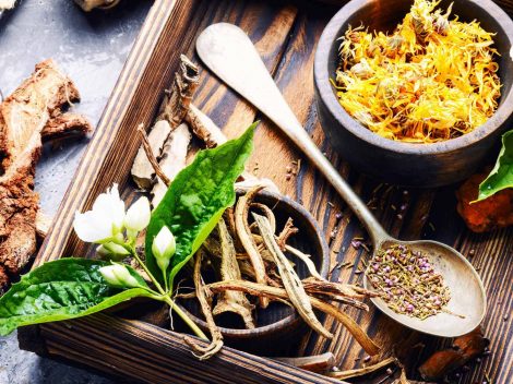 a wooden tray with herbs