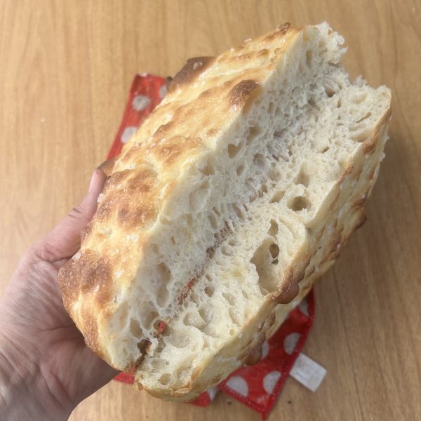 Focaccia cut open on the counter.