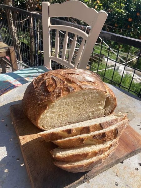 sourdough loaf sliced on an outside table